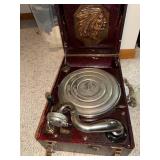 Antique Portable Phonograph with Native American Motif and Record Collection