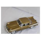 Gold Diecast Model Car with Opening Doors and Detailed Undercarriage Gold Diecast Model Car with Opening Doors and Detailed Undercarriage