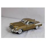 Gold Diecast Model Car with Opening Doors and Detailed Undercarriage Gold Diecast Model Car with Opening Doors and Detailed Undercarriage