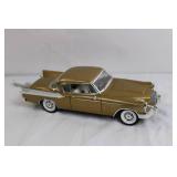 Gold Diecast Model Car with Opening Doors and Detailed Undercarriage Gold Diecast Model Car with Opening Doors and Detailed Undercarriage