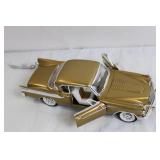 Gold Diecast Model Car with Opening Doors and Detailed Undercarriage Gold Diecast Model Car with Opening Doors and Detailed Undercarriage