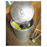 Metal trash can with lid containing... Metal trash can with lid containing...