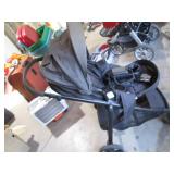 Modes folding up baby stroller... Modes folding up baby stroller...