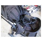 Modes folding up baby stroller... Modes folding up baby stroller...