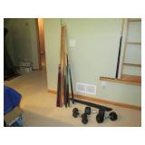 Lot of pool cues and assorted weigh... Lot of pool cues and assorted weigh...