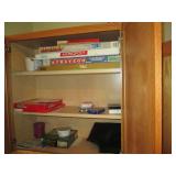 Oak cabinet filled with games and c... Oak cabinet filled with games and c...
