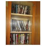 Oak cabinet filled with DVDs measur... Oak cabinet filled with DVDs measur...