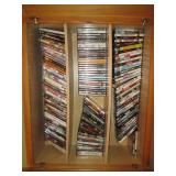 Oak cabinet filled with DVDs measur... Oak cabinet filled with DVDs measur...