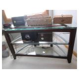 Small glass tv stand with contents... Small glass tv stand with contents...
