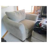 Oversized neutral ton upholstered c... Oversized neutral ton upholstered c...