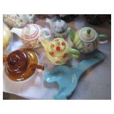 Collectable tea pots in varying sha...