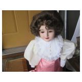 Vintage porcelain doll with stand...