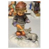 Vintage Hummels including "Ride into Christmas", "Peaceful Offering", "Skier", "Merry Wanderer" and "Lost Sheep"