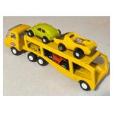 Collection of Vintage Tonka Toy Car Haulers with Die-Cast Cars