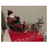 Four Clothique Santa Figurines