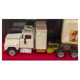 Four Beverage Diecast Semi Trucks and Cases
