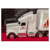 Six Diecast Semi Trucks and Cases
