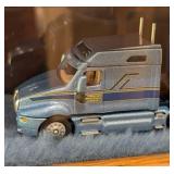 Six Diecast Semi Trucks and Cases