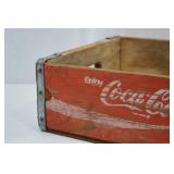 Vintage Wooden Coca-Cola Crate with Red Paint and Metal Reinforcement Vintage Wooden Coca-Cola Crate with Red Paint and Metal Reinforcement