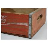 Vintage Wooden Coca-Cola Crate with Red Paint and Metal Reinforcement Vintage Wooden Coca-Cola Crate with Red Paint and Metal Reinforcement
