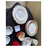 Assorted Dinnerware Collection with Plates, Bowls, Mugs, and Ramekins
