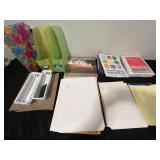 Assorted Office Supplies with Paper, Folders, and Calendars