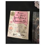 Mixed Lot of Family-Themed Books, Decorative Glassware, and Wall Clock