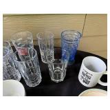 Assorted Kitchenware Collection with Glassware, Bowls, Plates, and Flatware