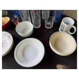 Assorted Kitchenware Collection with Glassware, Bowls, Plates, and Flatware