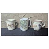 Collection of Mugs, Glassware, and Decorative Items Including Irish Pottery and Art Mug