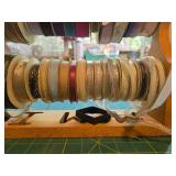 Collection of Assorted Decorative Ribbon Spools with Wooden Rack