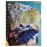 Collection of Assorted Purple and Floral Quilting Fabric Pieces