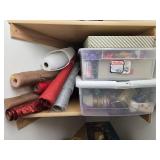 Collection of Gift Wrap Supplies with Rolls, Bows, Ribbons, and Decorative Pieces