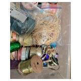 Collection of Gift Wrap Supplies with Rolls, Bows, Ribbons, and Decorative Pieces