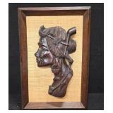 Wooden hand-carved wall plaque of indigenous woman