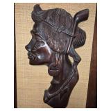 Wooden hand-carved wall plaque of indigenous woman