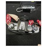Collection of vintage cameras and accessories