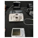 Collection of vintage cameras and accessories