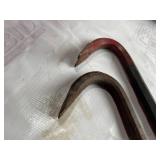 Two Hammers and Two Pry Bars with Red Handles and Rust Patina Two Hammers and Two Pry Bars with Red Handles and Rust Patina