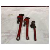 Three Red Pipe Wrenches in Various Sizes Three Red Pipe Wrenches in Various Sizes