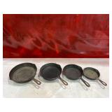 Four Assorted Cast Iron Skillets Including Wagner and Griswold Four Assorted Cast Iron Skillets Including Wagner and Griswold