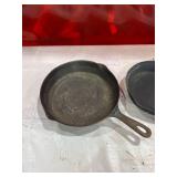 Four Assorted Cast Iron Skillets Including Wagner and Griswold Four Assorted Cast Iron Skillets Including Wagner and Griswold