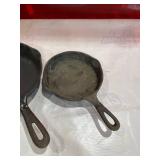 Four Assorted Cast Iron Skillets Including Wagner and Griswold Four Assorted Cast Iron Skillets Including Wagner and Griswold