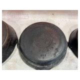 Four Assorted Cast Iron Skillets Including Wagner and Griswold Four Assorted Cast Iron Skillets Including Wagner and Griswold