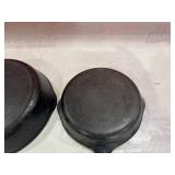 Four Assorted Cast Iron Skillets Including Wagner and Griswold Four Assorted Cast Iron Skillets Including Wagner and Griswold