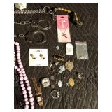 Lot of jewelry, lighter, handcuffs Lot of jewelry, lighter, handcuffs