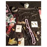 Lot of jewelry, lighter, handcuffs Lot of jewelry, lighter, handcuffs