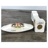 Small Collectible Figurines - Grandfather Clock and a Small Canoe that says city of London and British Manufactured Small Collectible Figurines - Grandfather Clock and a Small Canoe that says city of London and British Manufactured
