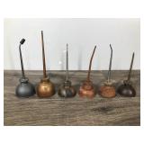 6 Small Collectible Thumb Press Oil Cans 6 Small Collectible Thumb Press Oil Cans