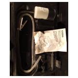 Electric airless paint sprayer in case Electric airless paint sprayer in case